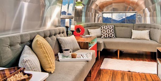 A stunning redo. Some Airstreams are dark but this has lots of windows and…